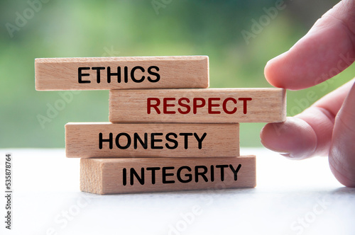 Wooden blocks with words Ethics, Respect, Honesty and Integrity. Business culture and code of conduct