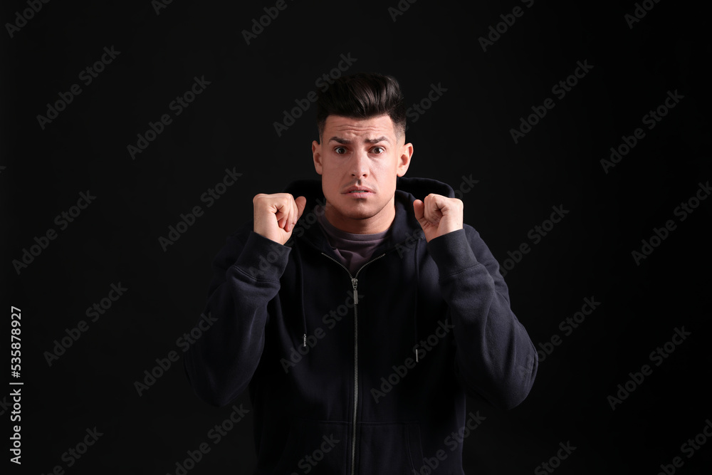 Portrait of emotional man on black background. Personality concept