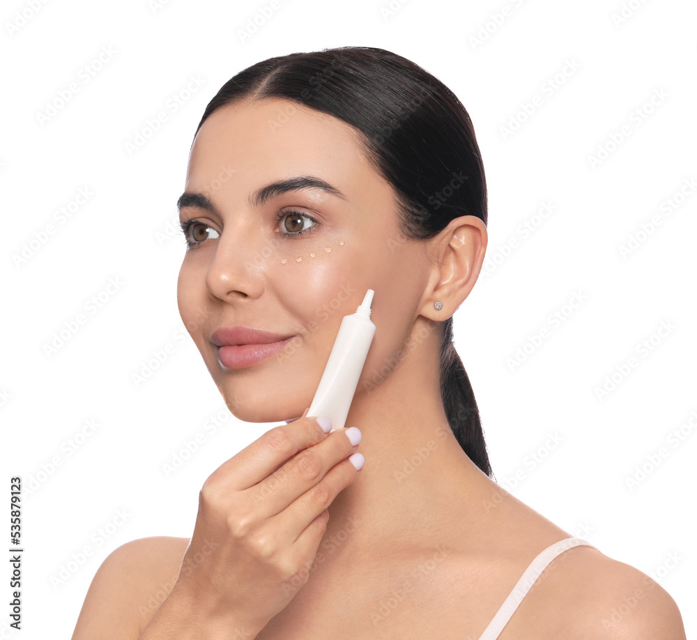 Beautiful young woman with gel on skin under eye against white background Beautiful young woman with gel on skin under eye against white background