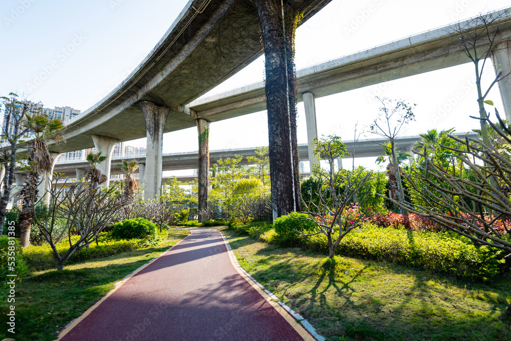 Fototapeta premium Red sidewalk under the overpass