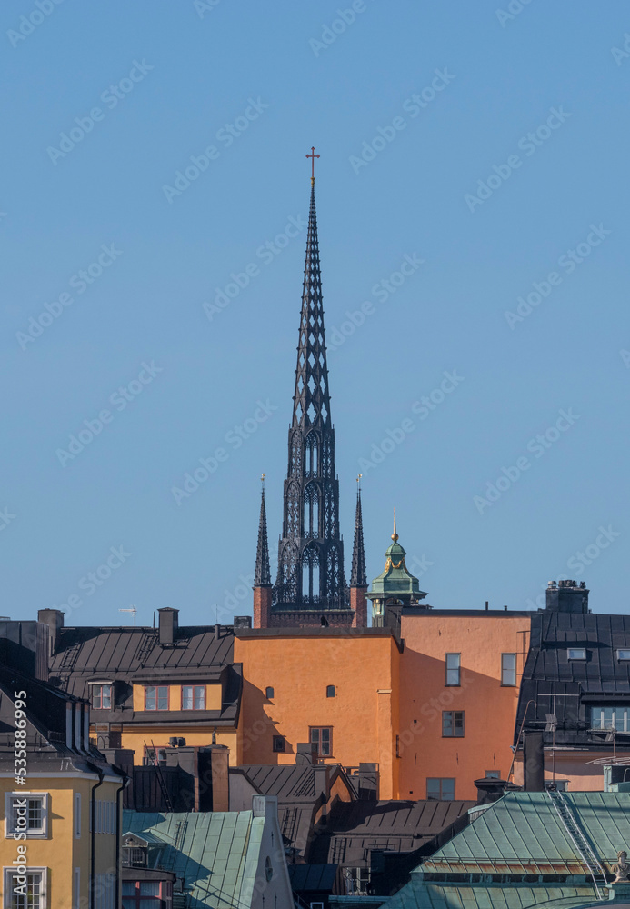 The gothic church tower of the Riddarholmskyrkan in the old town Gamla Stan a sunny autumn day in Stockholm