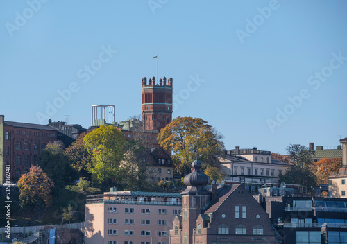 Photography Old brick water tower, hotels and apartment buildings in the district Södermalm