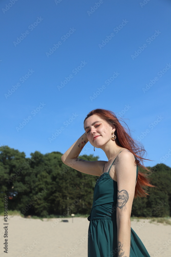 beautiful girl in a dress on the beach