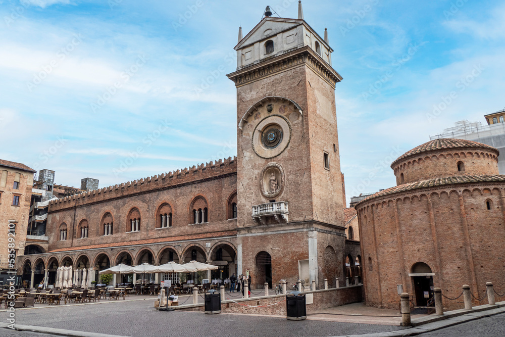 The Square of Erbe in Mantua with historical buildings and a beautiful clock tower