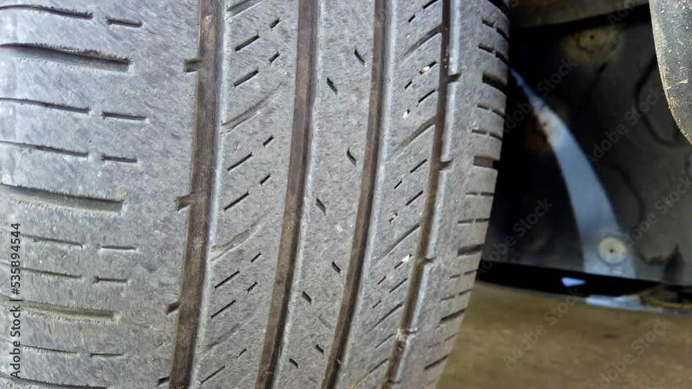 Close-up of a worn car tire for a road safety concept Close-up of a worn car tire for a road safety concept