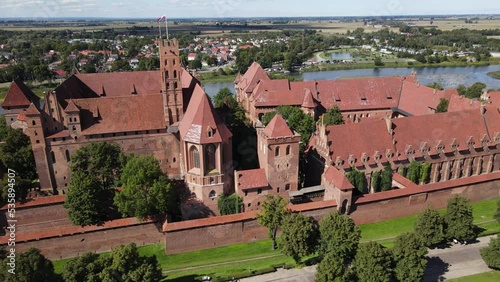 View from the drone at the medieval Teutonic Castle in Malbork on the Nogat River on a sunnz ,autumn daz. photo
