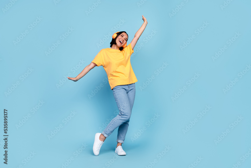 Full body size photo of young cute chinese lady dancer party disco empty space advert new headphones music isolated on bright blue color background