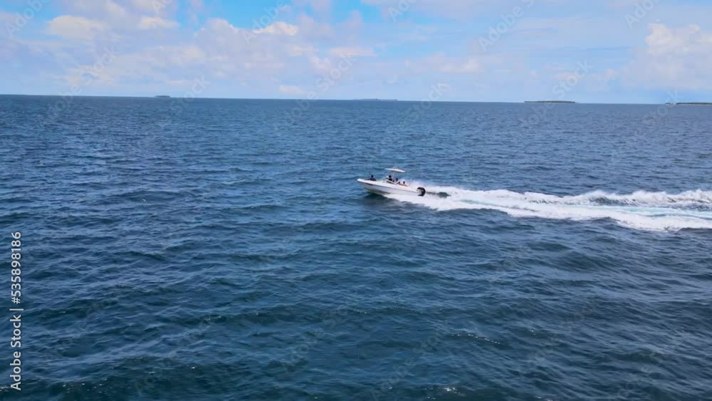 aerial view speed boat cruising in ocean travelling on beautiful blue sea sailing to holiday destination in mediterranean from above aerial view speed boat cruising in ocean travelling on beautiful blue sea sailing to holiday destination in mediterranean from above