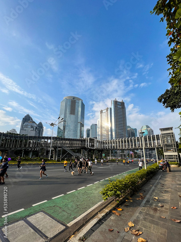 Aerial view of the A crowd of people enjoy Sunday morning near Bunderan Hotel Indonesia area. Car free day is finally back after the number of Covid-19.  photo