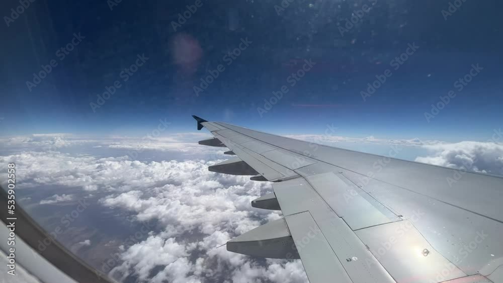 view from airplane window and clouds view from airplane window and clouds