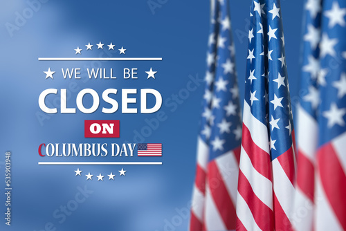 Columbus Day Background Design. American flag on background of blue sky with a message. We will be Closed on Columbus Day. photo