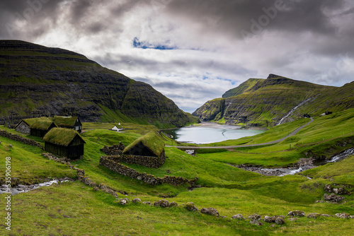 Obraz na płótnie Saksun is a remote little village on Streymoy island in the wild Faroe Islands. The village is famous for its unique location placed above a jaw-dropping lagoon. w salonie