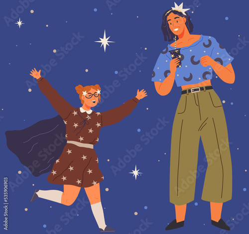 Animators at birthday party in cosmic style. Theme party in costumes. People in costumes have fun at space party. Characters in self made outfits surrounded by cosmic bodies and celestial objects
