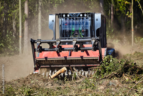 forest mulcher that cleans the soil in the forest. tracked general purpose vehicles used for vegetation and biomass management photo