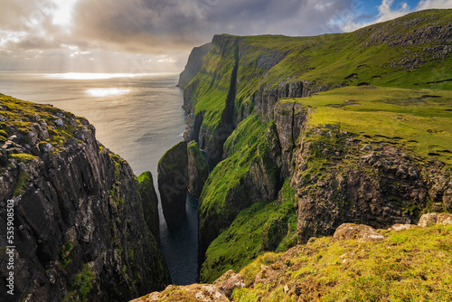 Dunnesdrangar is a name for the two 70 meter high sea stacks on Vágar island's south coast in Faroe islands.