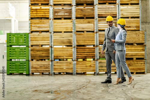 Businesspeople in warehouse discussing about work improvement. © dusanpetkovic1