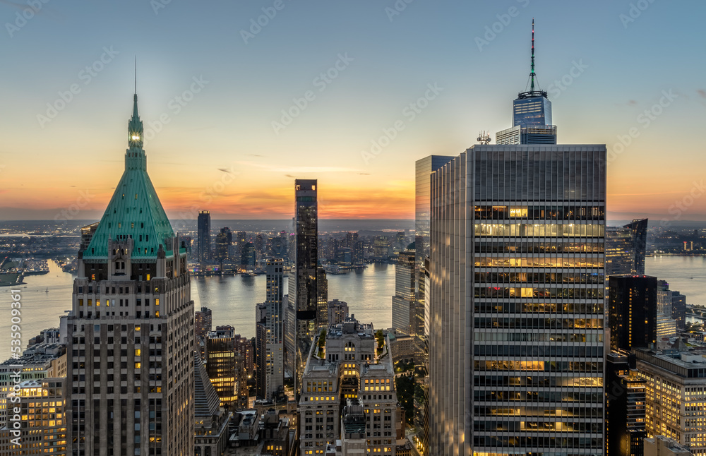 Aerial view of downtown NYC and New Jersey at sunset.