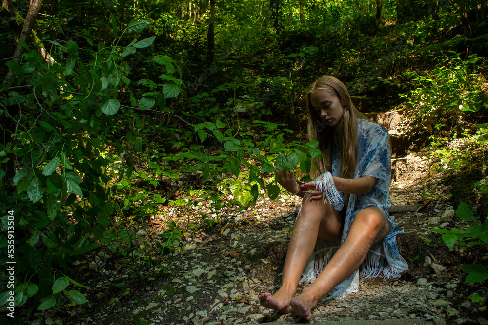 beautiful blonde in a swimsuit walks in the mountains beautiful blonde in a swimsuit walks in the mountains