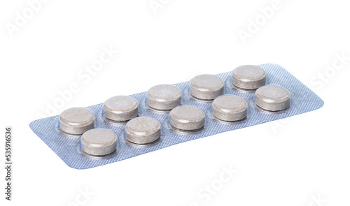 Foto Round pills in blister pack  on a white background, close up