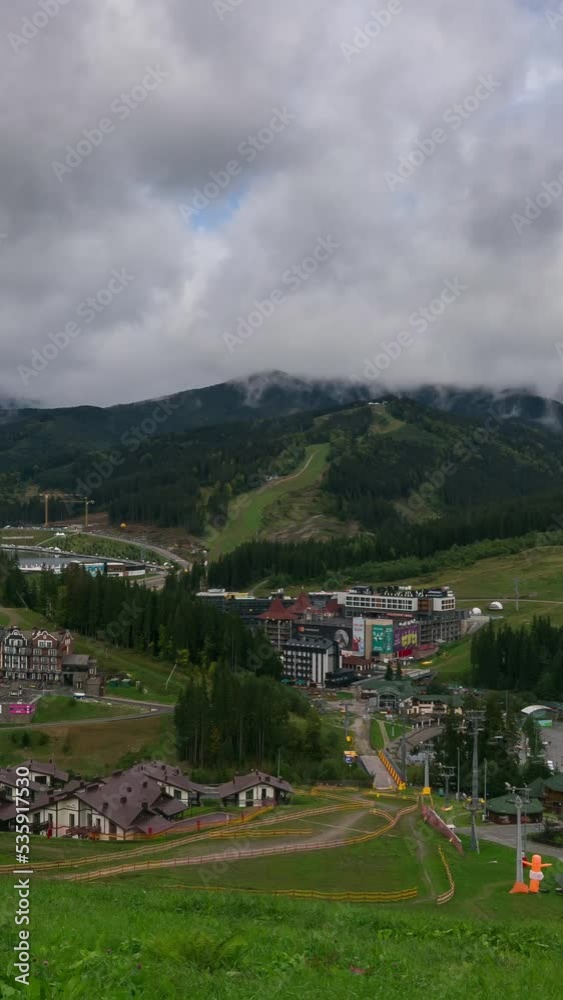 Clouds rise from the mountains after rain on a sunny autumn day at a ski resort. Timelapse. Pan Clouds rise from the mountains after rain on a sunny autumn day at a ski resort. Timelapse. Pan