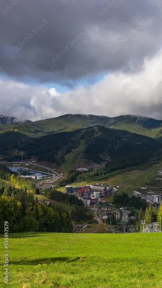 Clouds rise from the mountains after rain on a sunny autumn day at a ski resort. Timelapse. Pan Clouds rise from the mountains after rain on a sunny autumn day at a ski resort. Timelapse. Pan