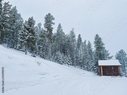 snowy rocky mountain landscape and cabin © Rachel