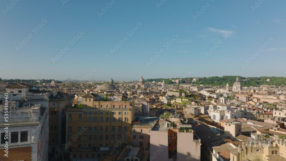 High angle view of streets and buildings in urban borough. Low traffic on roads at twilight. Rome, Italy High angle view of streets and buildings in urban borough. Low traffic on roads at twilight. Rome, Italy