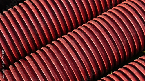 texture of corrugated red plastic tubes