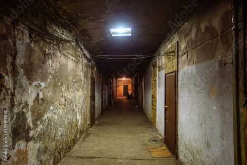 Dark corridor of old shabby dorm or appartment house