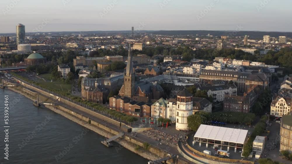 Aerial view of the old city by sunset with St Lambertus church, the Schiffahrtsmuseum and the Tonhalle concert hall Dusseldorf on the Rhine river, Germany Aerial view of the old city by sunset with St Lambertus church, the Schiffahrtsmuseum and the Tonhalle concert hall Dusseldorf on the Rhine river, Germany