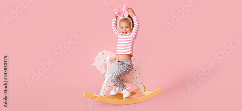 Adorable little girl playin...