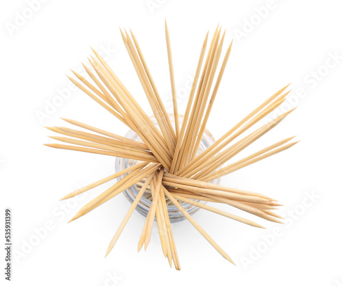 Glass jar with wooden skewers on white background