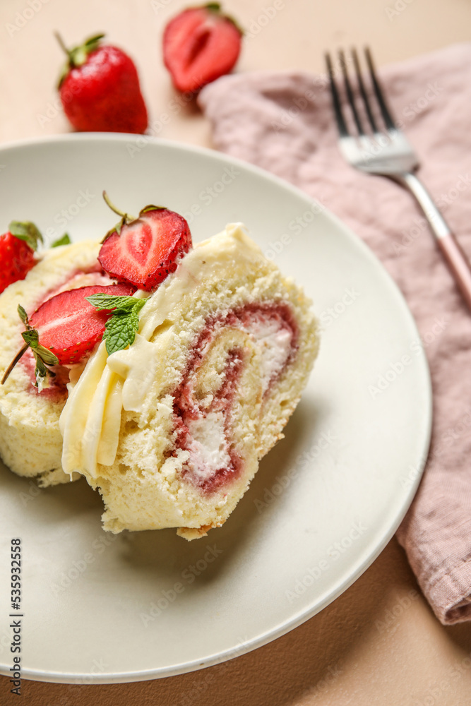 Plate with slices of tasty strawberry roll cake on table, closeup Plate with slices of tasty strawberry roll cake on table, closeup