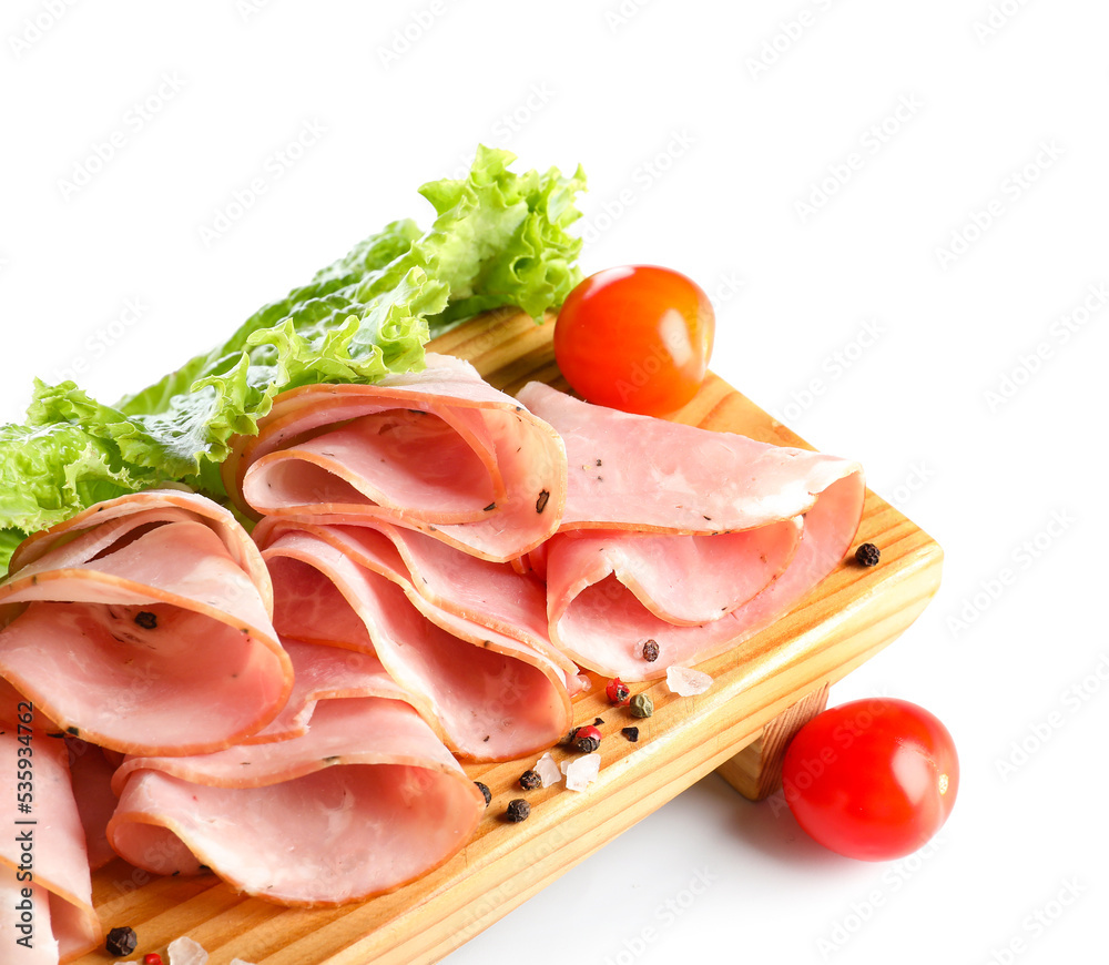 Wooden board with slices of tasty ham, tomatoes and lettuce on white background