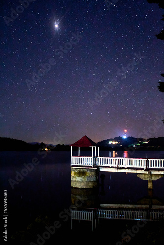 pier in dark lake, planet in the sky with stars around, el oro de hidalgo estado de mexico