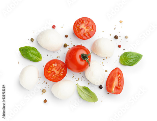 Cuadro en lienzo Tasty mozzarella cheese, tomatoes and spices isolated on white background