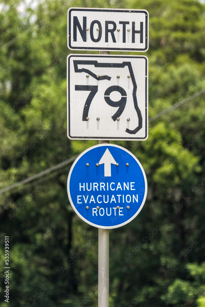 Hurricane Evacuation Route Road Sign on blue with arrow Hurricane Evacuation Route Road Sign on blue with arrow