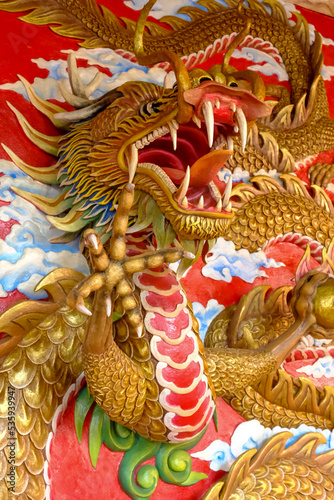 Malang, Indonesia-May 14 2022: Close up chinese dragon with red and golden color, mythical creatures at Eng An Kiong temple