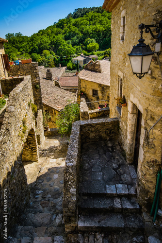 Narrow paved street and old houses in the medieval village of Saint Montan in the south of France  Ardeche 