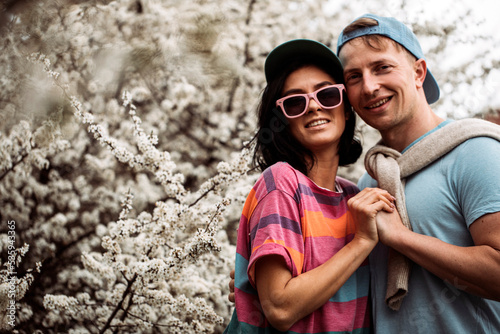 Couple in love. Sensual. Man and woman posing. Happy day. Background. Spring flowers. Girl. 