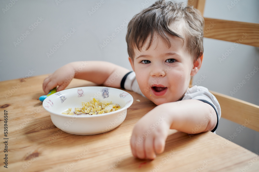 toddler eating eggs for breakfast and fooling around toddler eating eggs for breakfast and fooling around