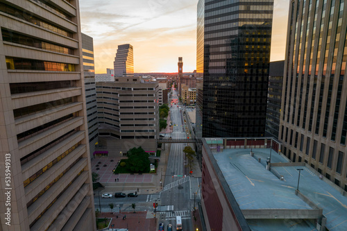 Aerial Drone View of Baltimore City Skyline at Sunset with Building Reflection