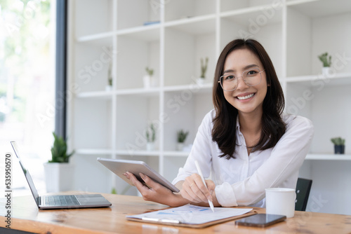 Smart asian business woman smiling at office space. real estate  lawyer  non-profit  marketing