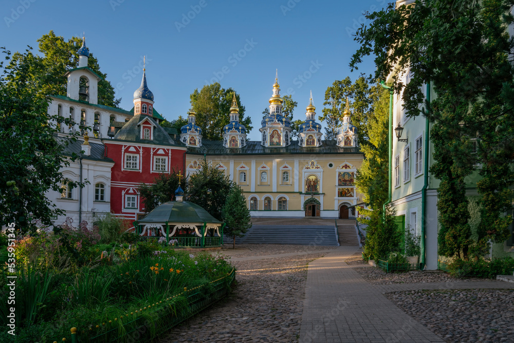 Fototapeta premium View of the Assumption Cathedral, the Great Belfry and the sacristy in the Holy Dormition Pskov-Pechersk Monastery on a sunny summer day, Pechory, Pskov region, Russia