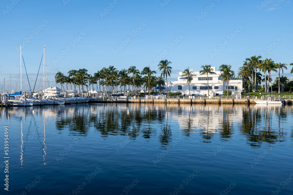 Miami City Hall and Dinner Key Marina in early morning light on calm autumn day.