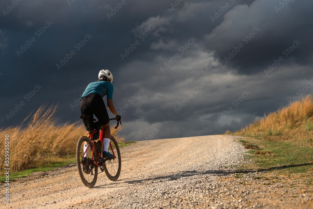 Cyclists practicing on gravel roads. Cyclists practicing on gravel roads.