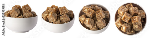 set of jaggery pieces in a bowl, golden brown colored cube shaped unrefined sugar product also called kithul jaggery or palm sugar, traditional food in southeast asia photo