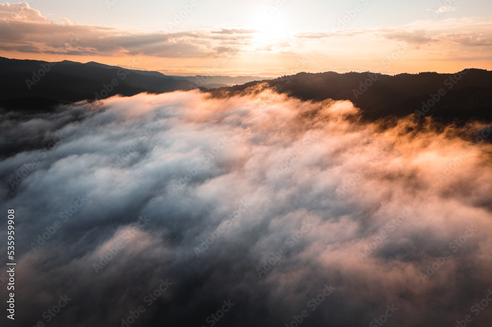 Fototapeta premium fog with mountains and light in the morning