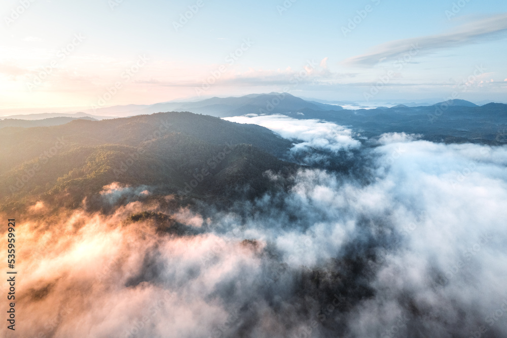 fog with mountains and light in the morning