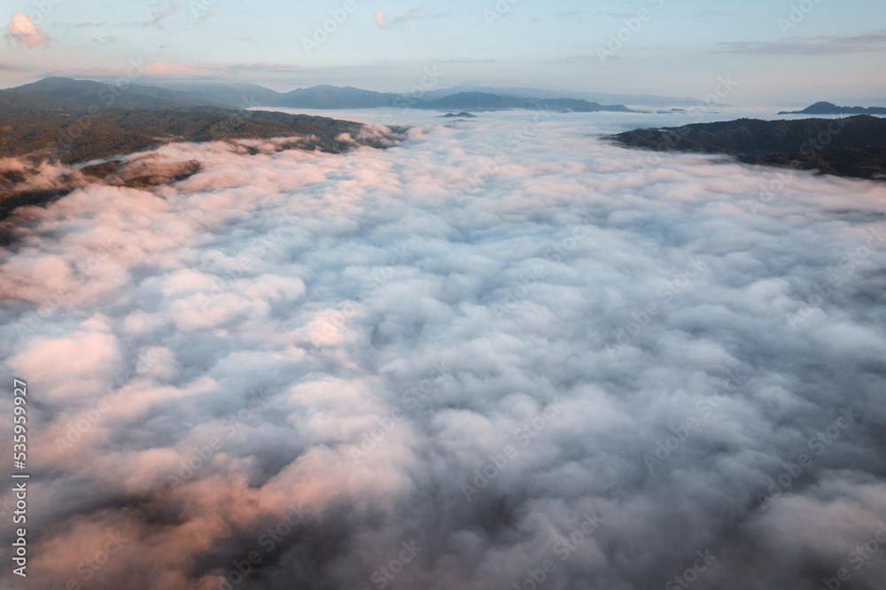 fog with mountains and light in the morning